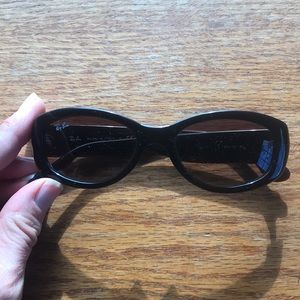 Ray Ban, small black frame sunglasses.